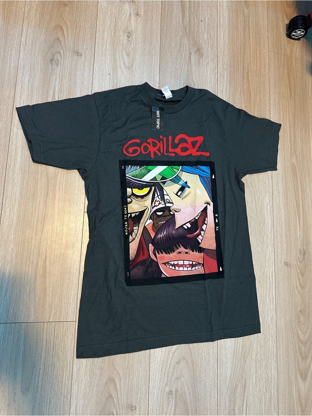Hot Topic Black Gorillaz Graphic Tee with Multicolor Band Art